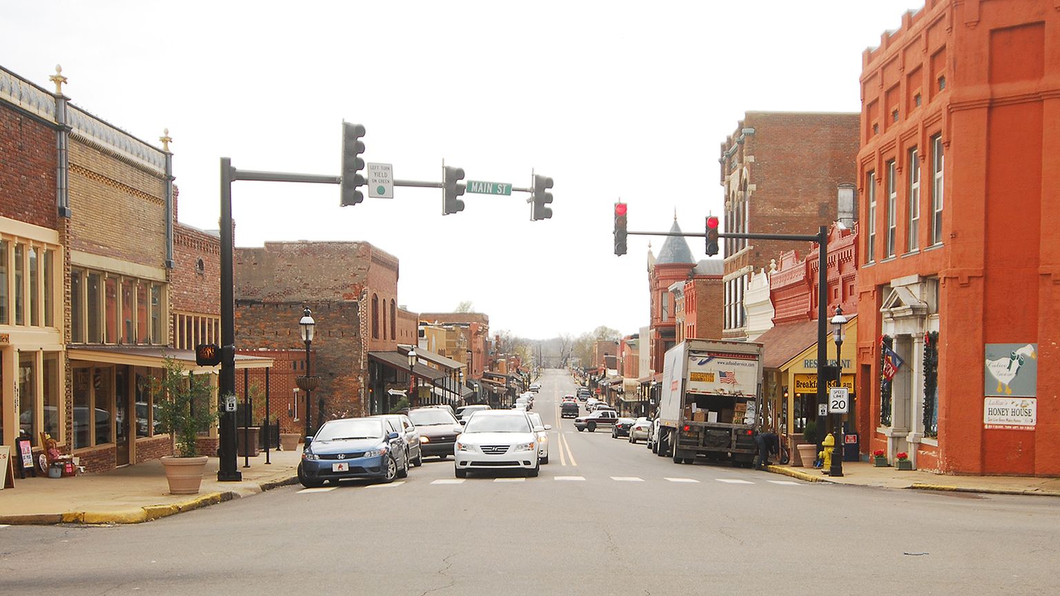 Main Street in Van Buren, Arkansas, lined with historic brick storefronts
